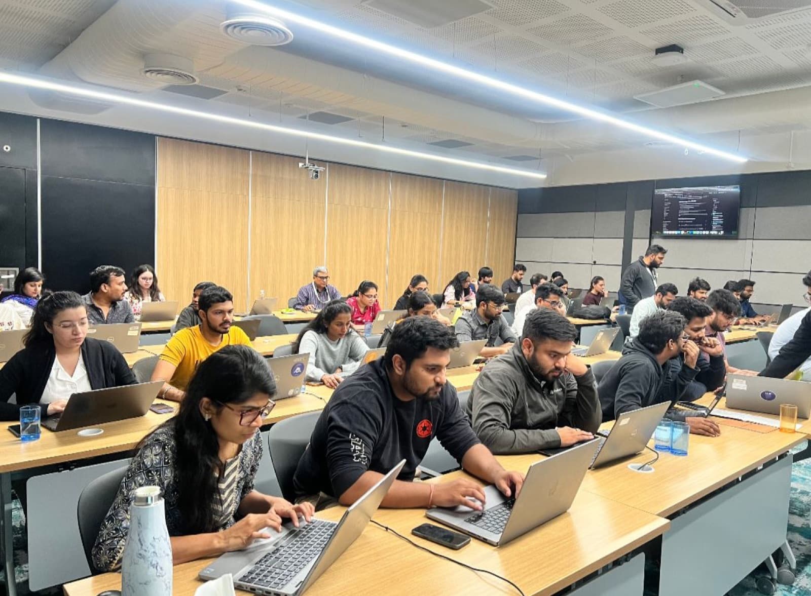 Engineers at laptops during a hands-on AI bootcamp