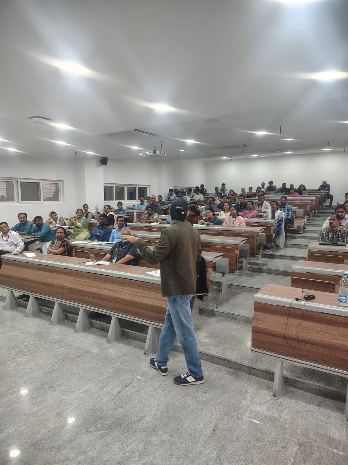 AI session for faculty and professionals in a tiered auditorium