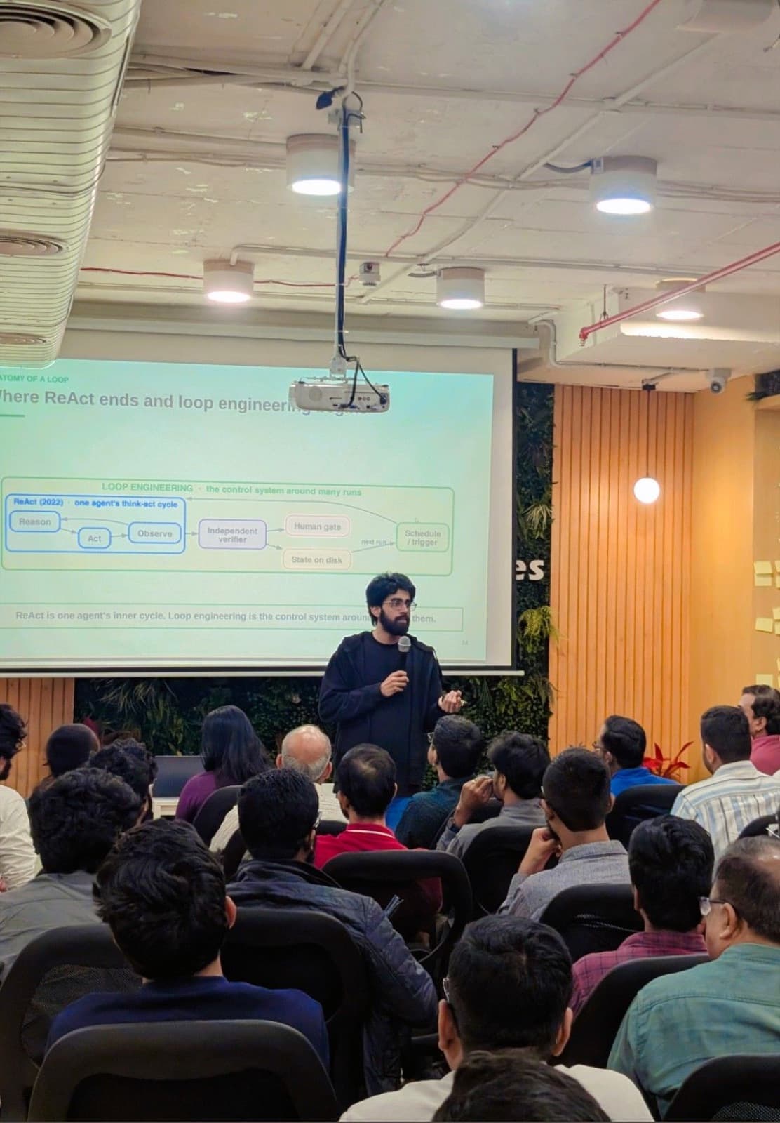 Speaker presenting agent loop engineering to a full room